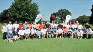 Group picture of golf series attendees