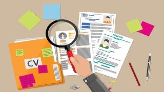 Cartoon magnifying glass over CV and Resumes