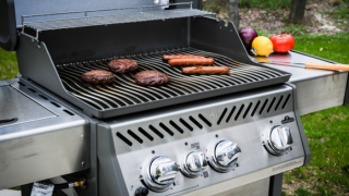 Grill with hot dogs and hamburgers