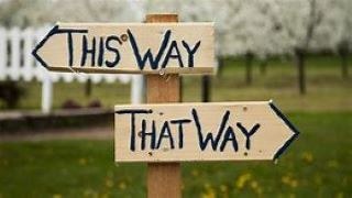 sign with arrows pointing in opposite directions