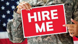 soldier-holding-hire-me-sign