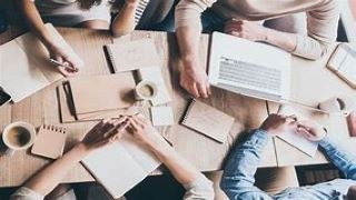 picture of a group of people writing